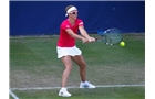 BIRMINGHAM, ENGLAND - JUNE 12:  Kirsten Flipkens of Belgium hits a return during Day Four of the Aegon Classic at Edgbaston Priory Club on June 12, 2014 in Birmingham, England.  (Photo by Paul Thomas/Getty Images)